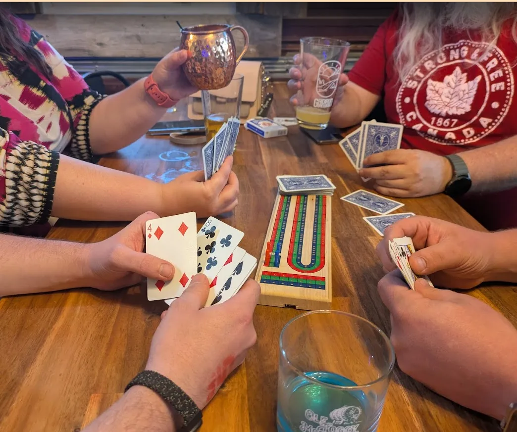 A card game in full swing between pints at the taproom